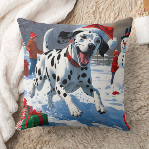Coussin Dalmatien courant dans la neige avec un chapeau de