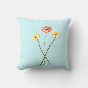 Coussin de fleurs de gerbera rouges jaunes pâles