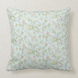 Coussin de jet floral doux avec fond vert menthe