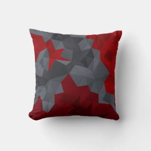 Coussin Des triangles gris, rouges disposés aléatoirement.