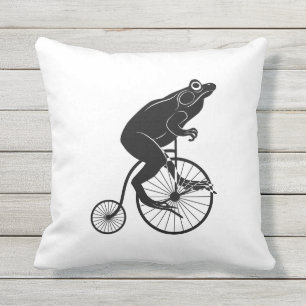 Coussin D'extérieur Grenouille ou crapaud noire et blanche sur un vél