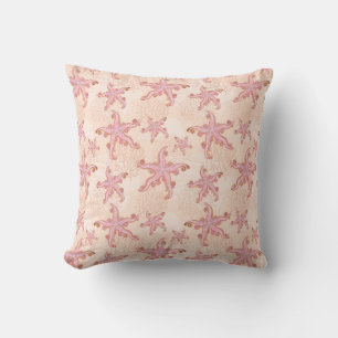 Coussin Étoiles de mer et motif pastel rose corail
