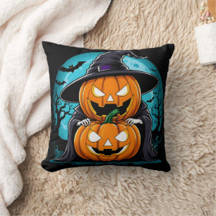 Coussin fantôme d'Halloween avec des citrouilles sous le c