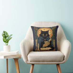 Coussin Félin de couleur noire lisant un livre de solstice