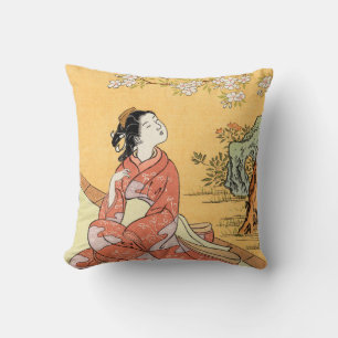 Coussin Femme assise sous les fleurs de cerisier