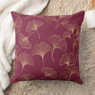 Coussin Feuilles de Ginkgo dorées luxueuses sur un bordeau