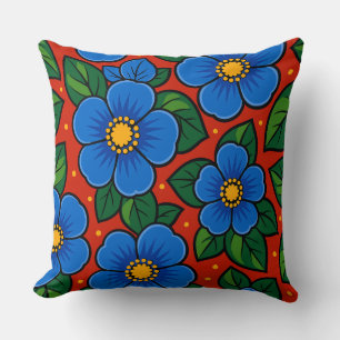Coussin Fleurs bleues et feuilles vertes sur fond rouge