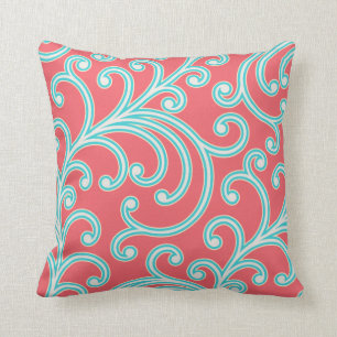 Coussin floral élégant en rouge et turquoise