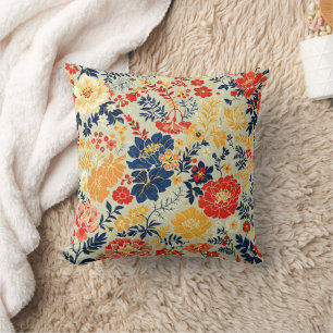 Coussin Flore vive rouge, jaune et bleu sur blanc