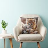 Coussin Fluffy red kitten playing with a tiny teddy bear,  (Chaise)