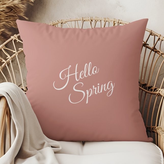 Coussin Hello Spring Dusty Rose Throw Pillow (Hello Spring Dusty Rose Throw Pillow in a boho rattan armchair.)