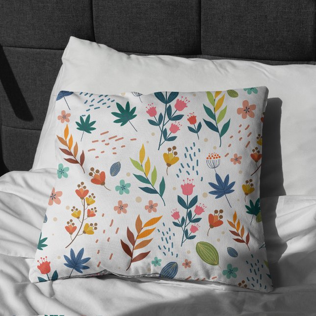 Coussin Impression florale colorée (Colorful Floral Print Pillow on bed)