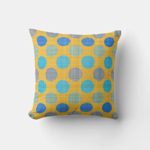 Coussin jaune avec des points texturés bleus et violets