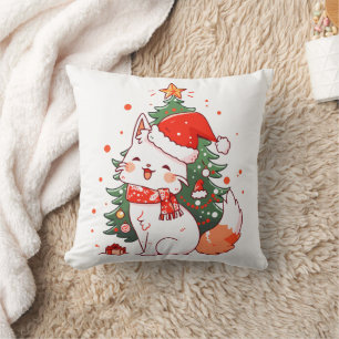 Coussin Joli chat portant un chapeau de Père Noël près de