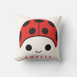 Coussin Jolie coccinelle souriante avec des taches noires