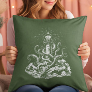 Coussin Kraken avalant un phare sur une toile verte