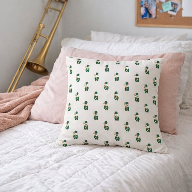 Coussin Lapin de la fanfare avec trombone vert or (A throw pillow with a pattern of white bunny rabbits holding a trombone.)