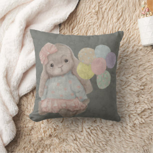 Coussin lapin mignon et duveteux avec un nœud et des ballo