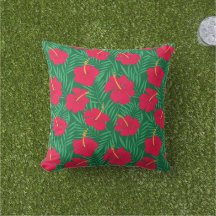 Les fleurs rouges d'Hibiscus sur les Feuilles trop