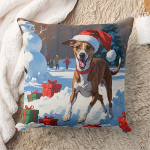 Coussin Lévrier courant dans la neige avec un chapeau de N