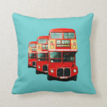 Coussin Londres Bus Cushion<br><div class="desc">Cushion (lancer l'oreiller) en couleur jade illustré par un montage de trois bus londoniens. Au verso se trouve une seule image du bus londonien d'autrefois.</div>