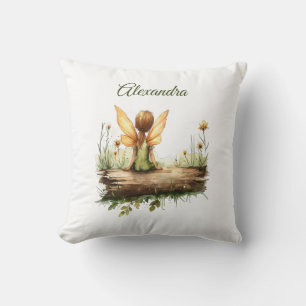 Coussin Lonely Fairy assis sur un journal
