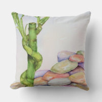 LUCKY BAMBOO PLANTE AMID COLORED ROCKS PATIO