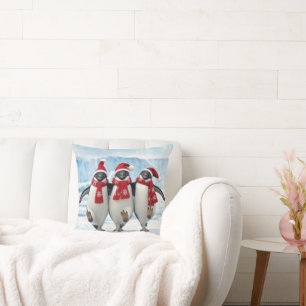 Coussin Manchots de Noël dansant sur un glacier arctique