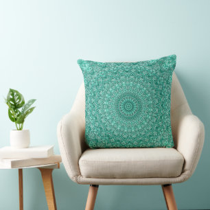 Coussin Mandala turquoise à symétrie complexe