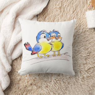 Coussin Merlesbleus sucrés sur une branche