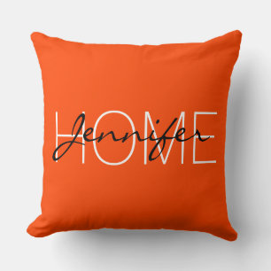 Coussin monogramme de la maison en couleur rouge orange