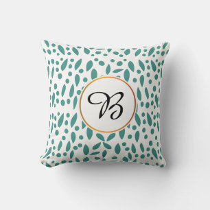 Coussin monogramme et feuille