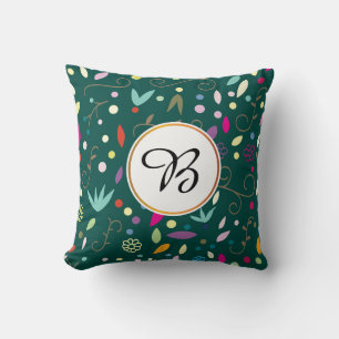Coussin monogramme et feuille