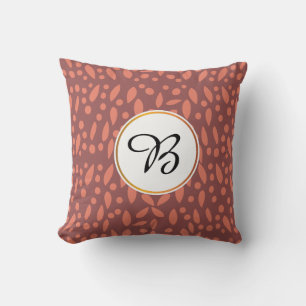 Coussin monogramme et feuille