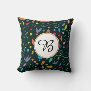 Coussin monogramme et feuille