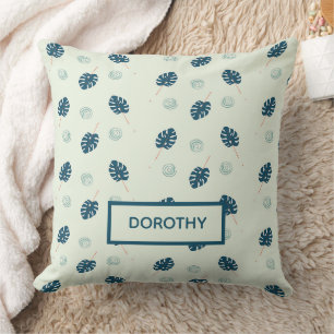 Coussin Monstère tropicale monogramme feuille sur bleu