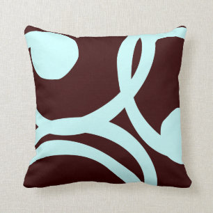 coussin motif abstrait turquoise et brun