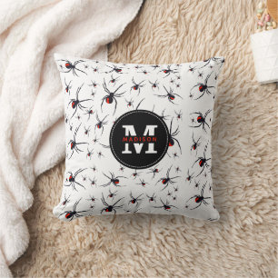 Coussin Motif araignée rouge et noir monogrammé