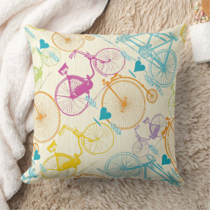 Coussin Motif de vélo jaune bleu rose rétro