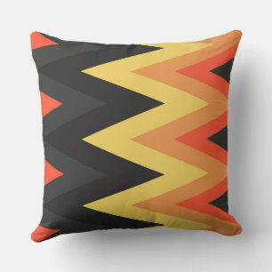 Coussin motif en chevron gris, orange et jaune