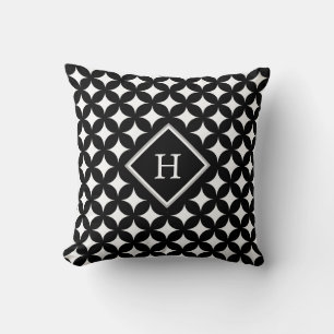 Coussin Motif monogramme et étoile à quatre branches sur f