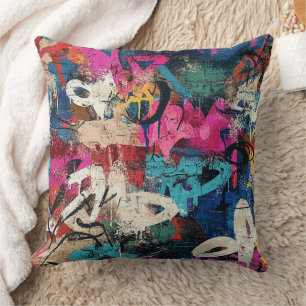 Coussin Mur de ville granuleux graffiti rose bleu noir
