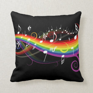 Coussin Notes blanches de musique d'arc-en-ciel sur le