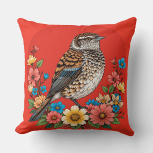 Coussin Oiseau coloré sur une branche encadré de fleurs