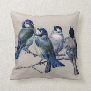 Coussin oiseaux bleus sur un arrière - plan gris