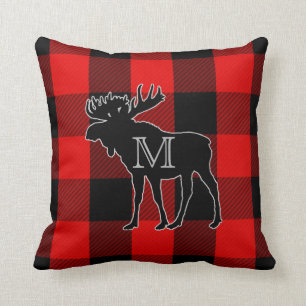 Coussin Orignaux décorés d'un monogramme rouges de très