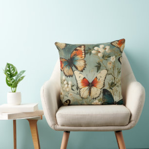 Coussin Papillon orange sarcelle antique sur fleur blanche