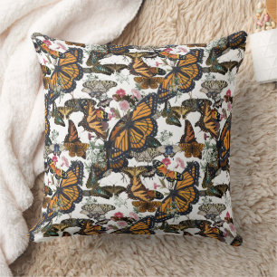 Coussin Papillons monarques et motif botanique floral