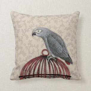 Coussin Perroquet de gris africain sur la cage à oiseaux