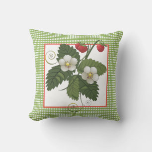Coussin Plante de fraise avec bordure à carreaux verts